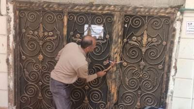 استمرار حملات تشميع المحلات المخالفة بدمياط الجديدة